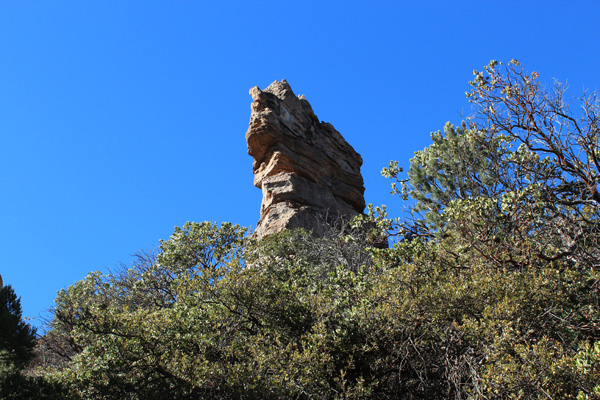 "Wolf Head Rock" watches from above the trail