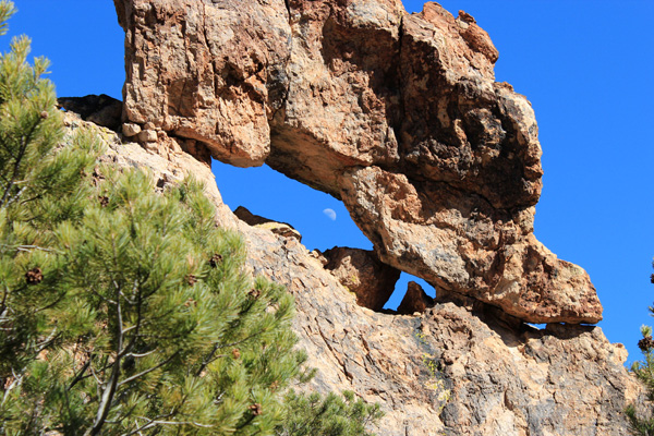 A natural window above a trail switchback