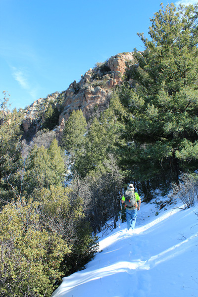 Eric descending the snowy switchbacks high on Bassett Peak