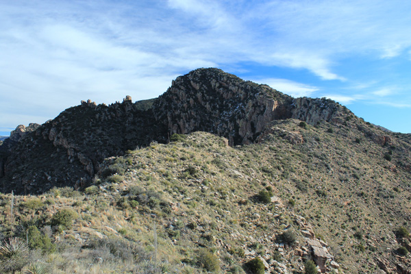 The Prominent Point summit is hidden behind the rocky ridge above the upper saddle