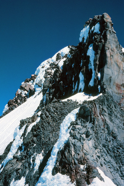 Mount Jefferson's summit rock pinnacles from the Red Saddle. On this climb we had to turn around due to high winds and steep loose snow. This can be a heartbreak after so much work to get this close.