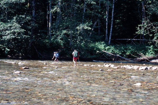 Wading across the North Fork of the Sauk River below Sloan Peak