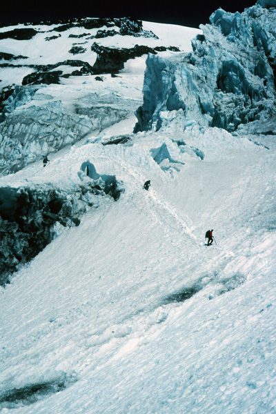Climbers descending around ice cliffs to leave the Kautz Glacier. Before dawn the next day we would climb up around these cliffs by headlamp and late in the morning descend quickly around these cliffs hoping not to get hit by ice.