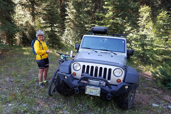 Linda prepares to descend the steep, rocky, and narrow road on her bike