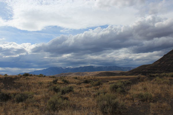 Heavy, dark clouds over Steens Mountain from Mickey Hot Springs