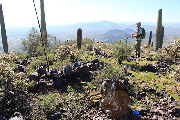 Bill on the Silver Reef Mountains Highpoint, the Tat Momoli Mountains in the distance