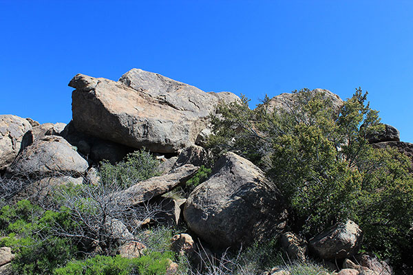The west side offers access to the base of the summit boulder