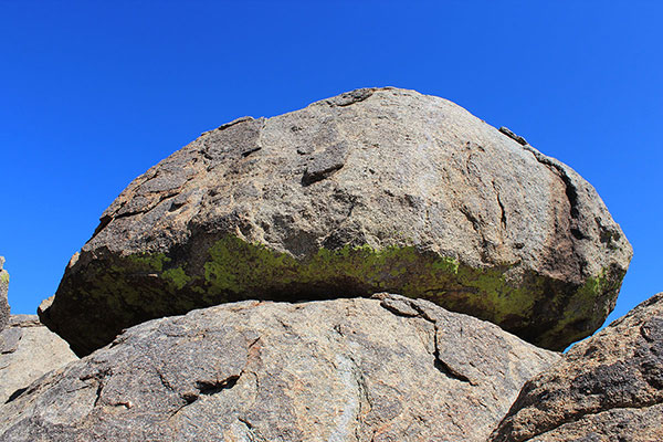 The overhanging summit boulder, the highpoint of the Date Creek Mountains