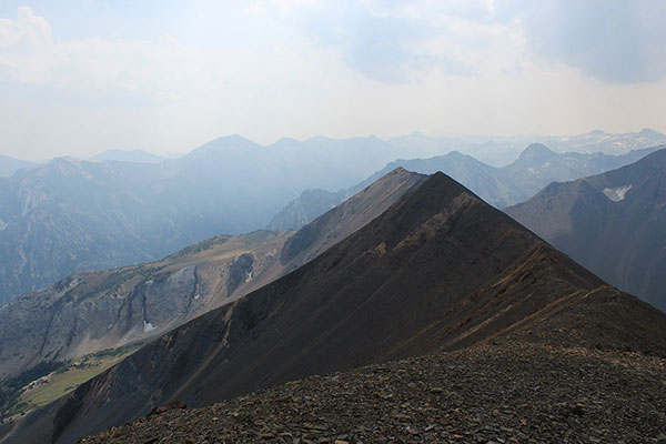 Looking south along the Hurwal Divide summit with Pete's Point left of center and Cusick Mountain beyond Hurwal Divide just right of center. It was a smoky day.