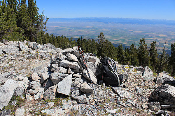 The summit cairn of Peak 8566 with a registry