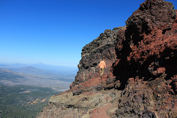 Bob leads down the foot path towards the basalt wall