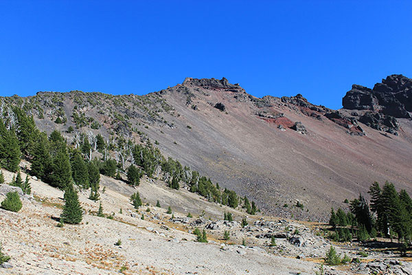 Broken Top and the popular scree descent route in afternoon light from the western cirque