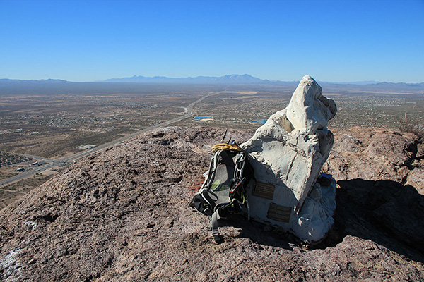 The summit of Cat Mountain, with Kitt Peak and Coyote Mountain in the distance beyond the fake rock