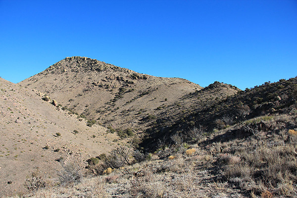 Once on the ridge I followed it up to the right to a saddle below Grease Benchmark rising on the left