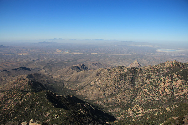 Looking west from the FLWO. Baboquivari Peak is the tower left of center on the skyline. Kitt Peak is just right of center on the skyline.