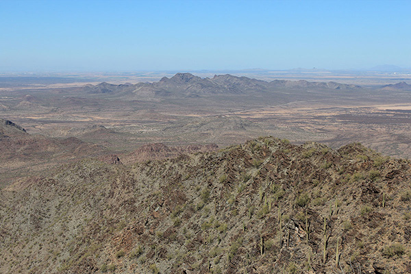 Looking down the north ridge towards the Tat Momoli Mountains; the Desert Queen Mine near our parking spot is just visible left of center