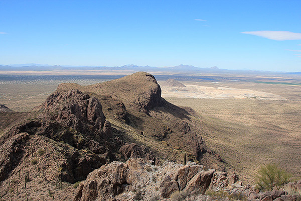 Panther Peak to the northwest; the Waterman and Silver Bell Mountains lie in the distance