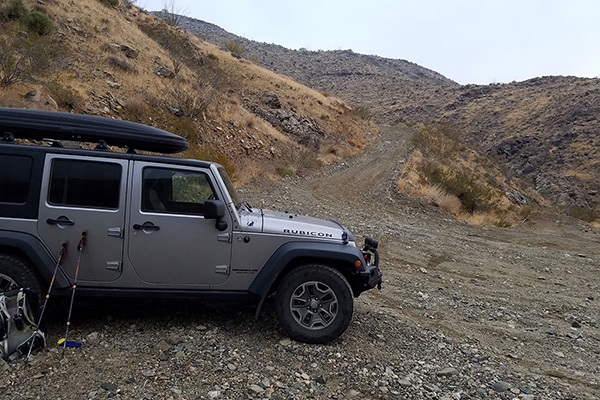 My Jeep parked below the steep climb around the ridge leading to a locked gate