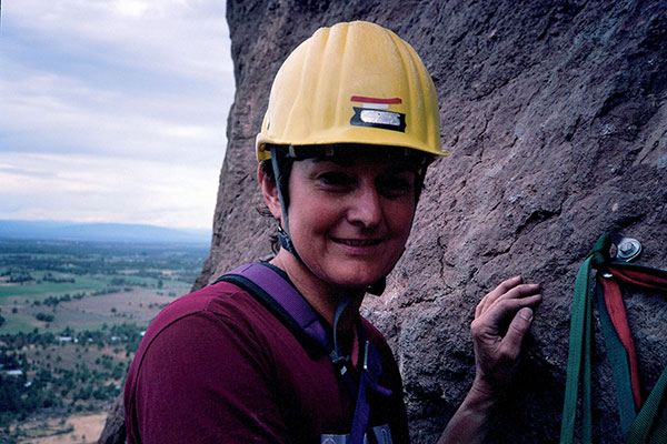 Linda watches me prepare to climb the bolt ladder from the Bohn Street ledge