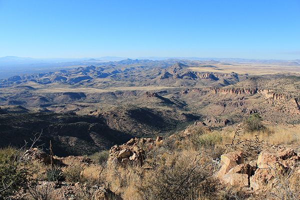 The view to the northwest from the Gila Peak summit. Our cars lie below the cliffy butte beyond the canyon in the center.