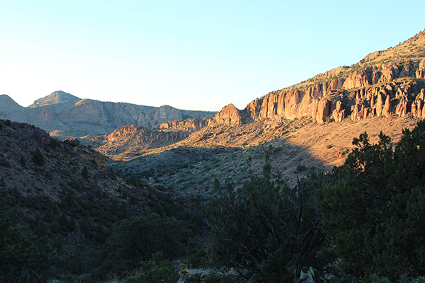 Late afternoon shadows fill the valley as we descend towards the creek bed.