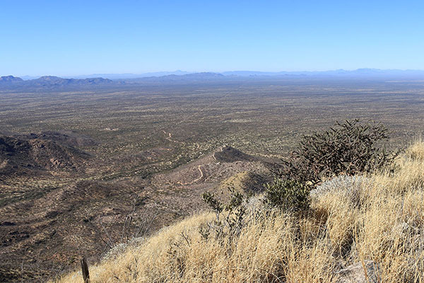 WNW along the border with the Sierra La Lezna (MX) and the La Lesna Mountains (US) straddling the border in the distance.