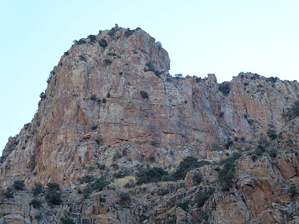 A brushy ledge leads from the notch on the right across the tower to the left to access the summit