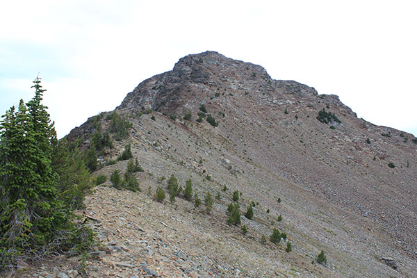 The upper Southeast Ridge leads north to the steep South Face of Krag Peak.