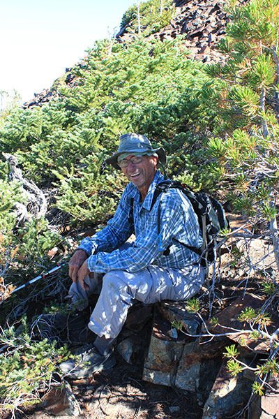 We regroup above the talus slopes in shade on the south ridge