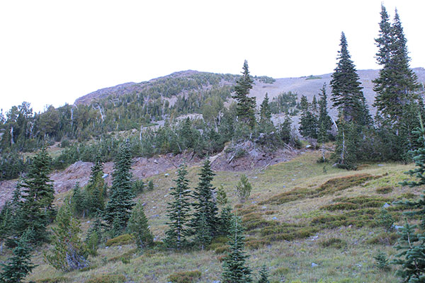 Approaching the loose west face of Red Mountain