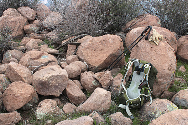 The WEBSTER benchmark is mounted on a boulder to the left