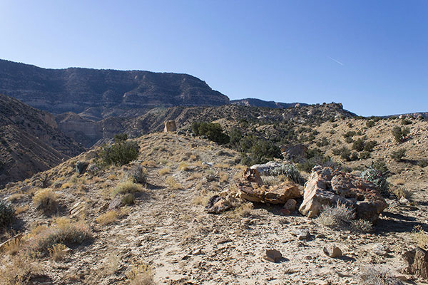 The Yazzie Trail follows ridges south towards the cliffs ahead