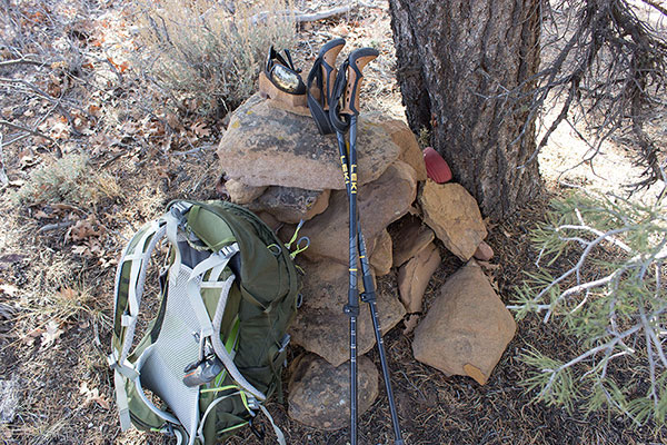 The Black Mesa highpoint rock cairn and a red can containing the summit registry