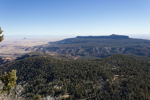 Ship Rock and Beautiful Mountain, both in New Mexico, to the east from Roof Butte