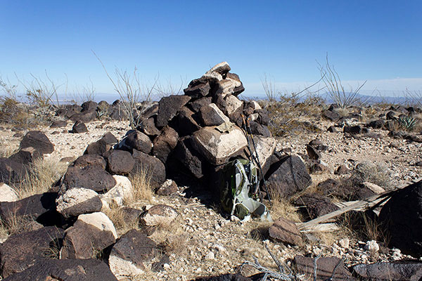 The Black Mesa summit cairn, containing a recent summit registry