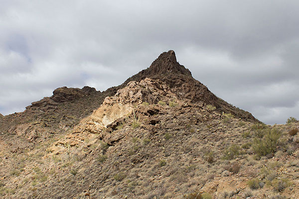 From the lower saddle I can view the Pinkley Peak summit. My next goal is to traverse across slopes then climb up the gully to the higher saddle below the summit to the left.