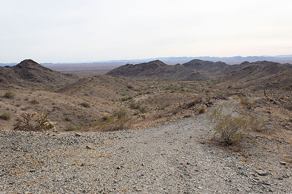 I walk the road down the valley to my Jeep out of view behind the hill on the left