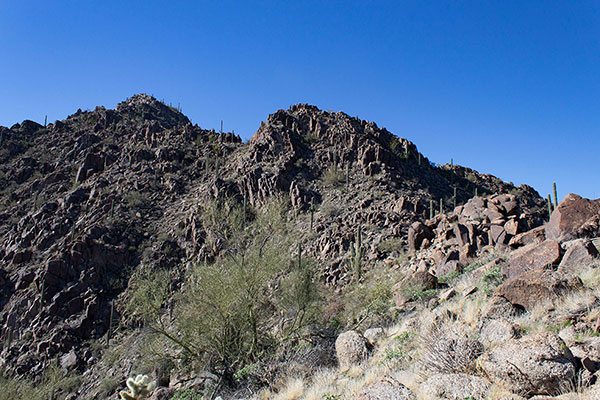 With Nose Benchmark on the left, a notch on the right provides access around the buttress above