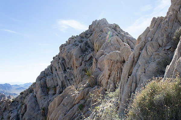 From just below the notch we traverse left along a ledge towards the summit ahead