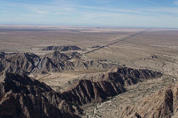 Our highpoint view west along the US/Mexico Border wall