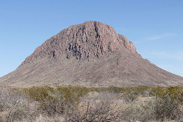 Orange Butte rises steeply to the east from our access road.