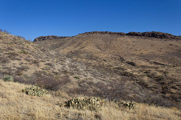 My route ascends directly up the steep slope ahead, through low cliffs, then left along the ridge